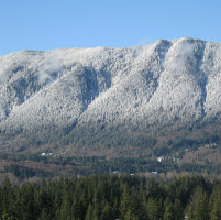 Mountainous ridge covered in light snow.