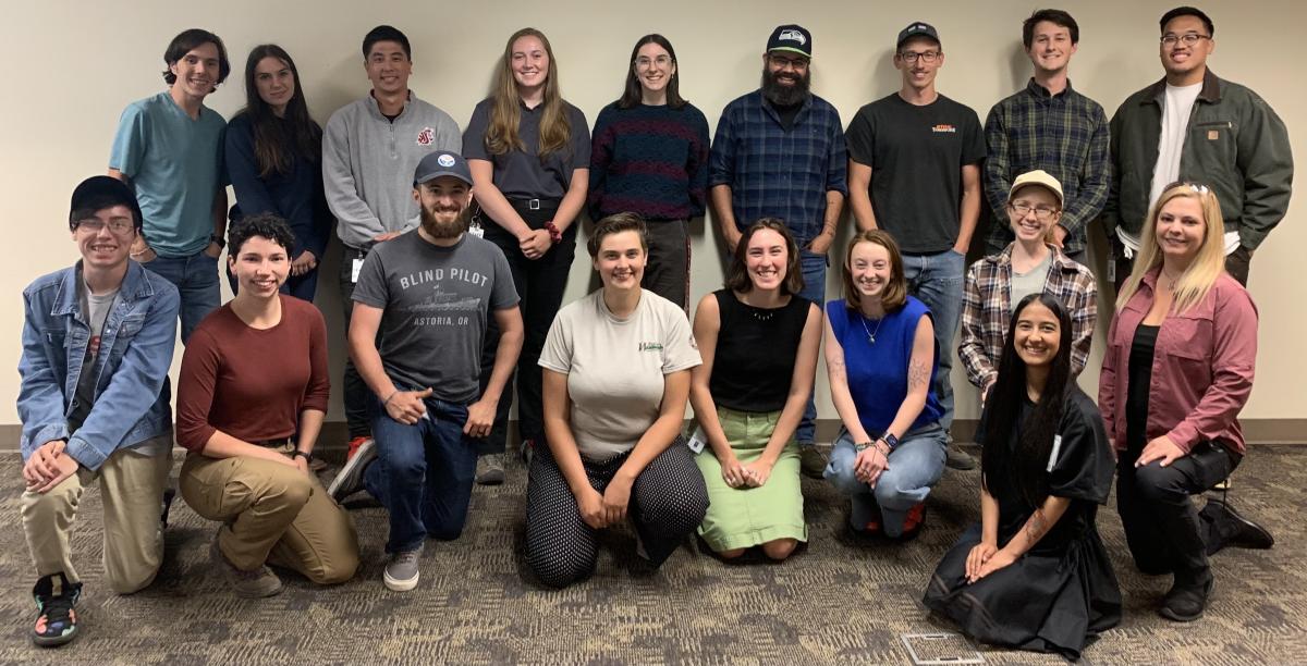 Interns posing for a group photo in a conference room