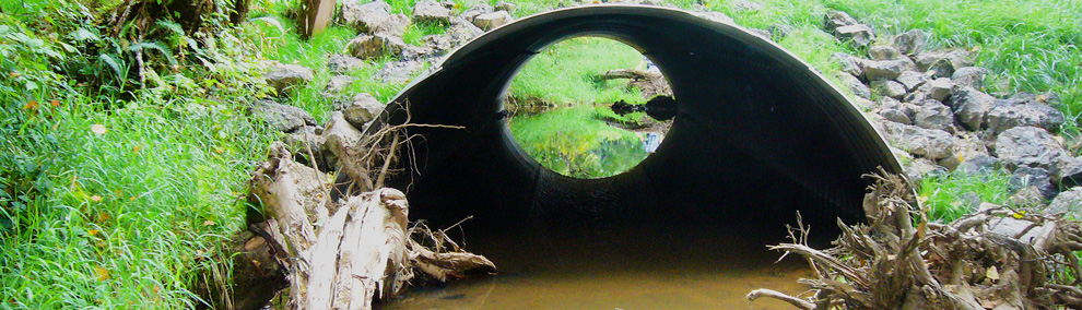 Color photo of large culvert which allows ample room for fish passage
