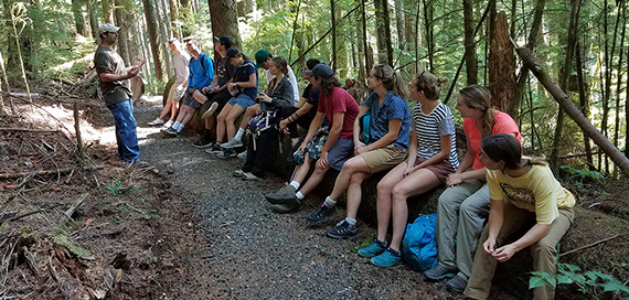 DNR staff giving a field tour to university students